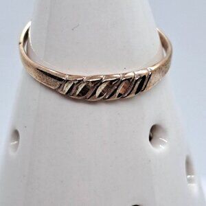 Size 7.75.  Sterling silver ring cross cut signed/marked with a "$"